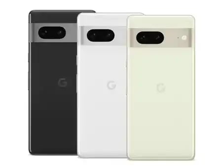 Google Pixel 7a smartphone in three colors: Charcoal, Snow, and Sage. Each phone features a sleek design with a dual-camera setup and a smooth finish. Displayed against a plain background, showcasing the modern aesthetic.